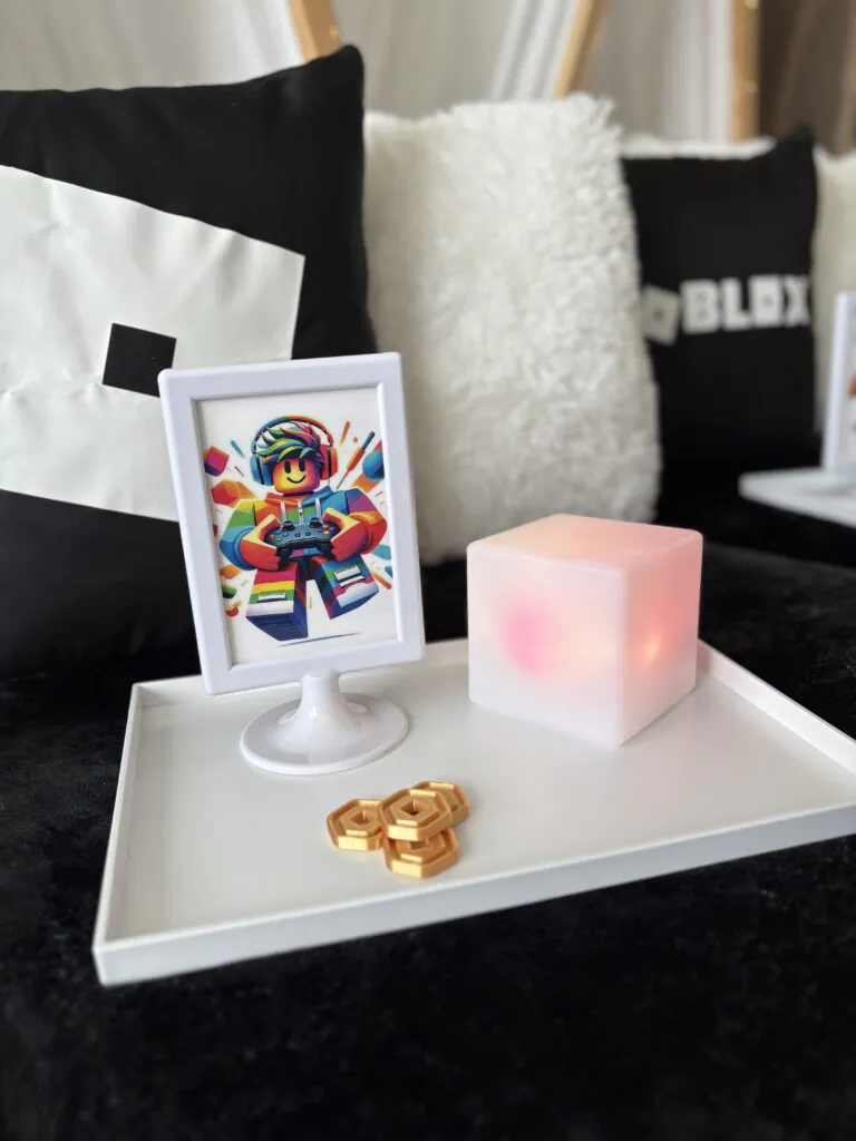 Kids Roblox slumber party rental featuring themed teepees, personalized trays, gaming-inspired decorations, and coordinated bedding for an at-home birthday party.